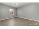 Spacious bedroom with hardwood floors and gray walls at 1176 Peppertree Dr, Mount Holly, NC 28120