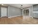 Dining area with hardwood floors and access to deck at 1176 Peppertree Dr, Mount Holly, NC 28120