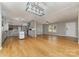 Open concept kitchen with gray cabinets and kitchen island at 1176 Peppertree Dr, Mount Holly, NC 28120
