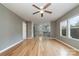 Hardwood floor living room with view into kitchen and ceiling fan at 1176 Peppertree Dr, Mount Holly, NC 28120
