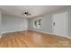 Bright living room with hardwood floors and ceiling fan at 1176 Peppertree Dr, Mount Holly, NC 28120