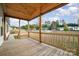 Wooden porch overlooks the quiet neighborhood at 1176 Peppertree Dr, Mount Holly, NC 28120