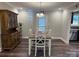 Bright dining area with hardwood floors and a view of the backyard at 1204D Northgate Dr, Shelby, NC 28150