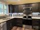 Modern kitchen with stainless steel appliances and granite countertops at 1204D Northgate Dr, Shelby, NC 28150