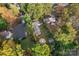 Aerial view of a house with a large backyard, patio, and detached shed at 138 Wyanoke Ave, Charlotte, NC 28205