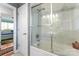 Elegant bathroom with marble tile and a walk-in shower at 138 Wyanoke Ave, Charlotte, NC 28205