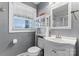 Clean bathroom with white vanity and a shower/tub combo at 138 Wyanoke Ave, Charlotte, NC 28205