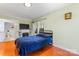 Simple bedroom with a bed, fireplace, and access to bathroom at 138 Wyanoke Ave, Charlotte, NC 28205
