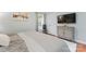 Main bedroom with hardwood floors, a media console, and window at 138 Wyanoke Ave, Charlotte, NC 28205