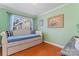 Charming bedroom with a daybed and hardwood floors at 138 Wyanoke Ave, Charlotte, NC 28205