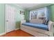 Relaxing bedroom with a daybed and hardwood floors at 138 Wyanoke Ave, Charlotte, NC 28205