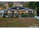 Inviting curb appeal with a renovated front porch and landscaping at 138 Wyanoke Ave, Charlotte, NC 28205