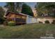 House exterior view showcasing the screened porch and backyard at 138 Wyanoke Ave, Charlotte, NC 28205