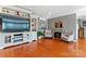 Living room with hardwood floors, fireplace, and built-in entertainment center at 138 Wyanoke Ave, Charlotte, NC 28205