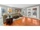 Living room with hardwood floors, comfy seating, and access to patio at 138 Wyanoke Ave, Charlotte, NC 28205