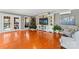 Living room features built-in entertainment center, hardwood floors, a Christmas tree, and a sliding door to the outside at 138 Wyanoke Ave, Charlotte, NC 28205