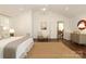 Bedroom with hardwood floors and connecting dining room visible through doorway at 3452 Airlie St, Charlotte, NC 28205