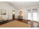 Bedroom with hardwood floors and connecting dining room visible through doorway at 3452 Airlie St, Charlotte, NC 28205