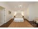 Bedroom with vaulted ceiling, hardwood floors, neutral decor, and lots of natural light at 3452 Airlie St, Charlotte, NC 28205