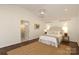 Bright bedroom features a vaulted ceiling, hardwood floors, neutral decor, and natural light at 3452 Airlie St, Charlotte, NC 28205