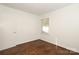 Bright bedroom features hardwood floors and natural light from the large window at 3452 Airlie St, Charlotte, NC 28205