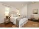 Bright bedroom with hardwood floors, side tables, lots of natural light, and neutral decor at 3452 Airlie St, Charlotte, NC 28205
