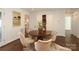 Dining room with white walls, hardwood floors, a round table, and built-in hutch at 3452 Airlie St, Charlotte, NC 28205