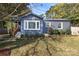 This lovely home features a manicured lawn and tasteful landscaping at 3452 Airlie St, Charlotte, NC 28205