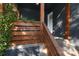 Inviting front porch with wooden railing and decorative address display at 3452 Airlie St, Charlotte, NC 28205