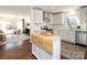 Modern kitchen with stainless steel appliances, white cabinetry, and breakfast bar at 3452 Airlie St, Charlotte, NC 28205