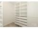 Organized walk-in closet with shelving, drawers, and ample storage space at 3452 Airlie St, Charlotte, NC 28205