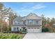 Charming two-story home featuring a well-maintained front yard, attached two-car garage, and classic architectural details at 6003 Hawk View Rd, Waxhaw, NC 28173