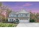 Charming two-story home featuring a well-maintained front yard, attached two-car garage, and classic architectural details at 6003 Hawk View Rd, Waxhaw, NC 28173