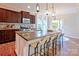 Spacious kitchen with granite countertops, stainless steel appliances, and a large island with bar seating at 6003 Hawk View Rd, Waxhaw, NC 28173