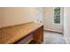 Convenient laundry room with countertop, storage, and a window at 6003 Hawk View Rd, Waxhaw, NC 28173