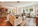 Bright living room with hardwood floors, large windows, comfortable seating, and an open layout at 6003 Hawk View Rd, Waxhaw, NC 28173