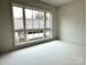 Bright, airy bedroom with a large window offering neighborhood views at 1168 Queens Rd, Charlotte, NC 28207