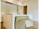 A closer view of the kitchen island, with a marble countertop and seating beneath at 1168 Queens Rd, Charlotte, NC 28207