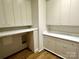 Well-lit laundry room with custom cabinetry and marble countertops at 1168 Queens Rd, Charlotte, NC 28207