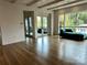 Spacious living area with hardwood floors, expansive windows, and modern design at 1168 Queens Rd, Charlotte, NC 28207