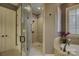 Bathroom with a large walk-in shower and tiled walls at 16908 Ashton Oaks Dr, Charlotte, NC 28278