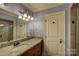 Bathroom with granite vanity, large mirror, and a separate shower at 16908 Ashton Oaks Dr, Charlotte, NC 28278