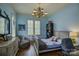 Bright bedroom with a light blue color scheme and built-in shelving at 16908 Ashton Oaks Dr, Charlotte, NC 28278