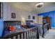 Twin bedroom with blue walls and playful decor at 16908 Ashton Oaks Dr, Charlotte, NC 28278