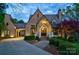 Elegant home exterior with stone facade and landscaping at 16908 Ashton Oaks Dr, Charlotte, NC 28278