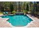 Relaxing pool with fountain feature and plenty of surrounding space at 16908 Ashton Oaks Dr, Charlotte, NC 28278