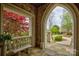 Stone porch with arched entryway, offering scenic views at 16908 Ashton Oaks Dr, Charlotte, NC 28278