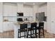 Modern kitchen with white cabinets, stainless steel appliances, and a granite countertop island at 209 Alden Ct, Shelby, NC 28152