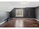 Spacious bedroom with dark walls and hardwood floors at 216 Devon Forest Dr, Mooresville, NC 28115