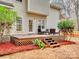 Elevated deck with steps, surrounded by red mulch at 216 Devon Forest Dr, Mooresville, NC 28115